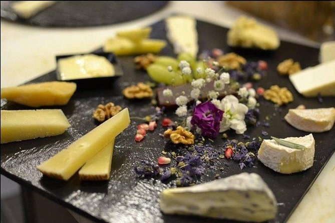 Italian cheeses on a slate with walnuts and honey