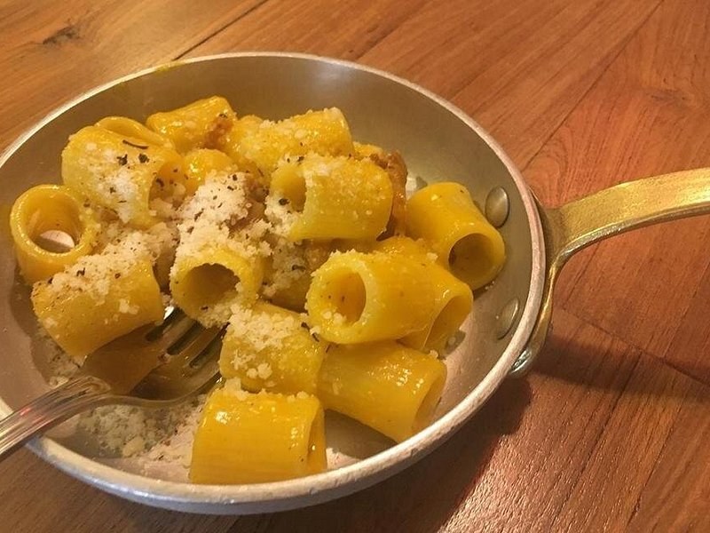 Rigatoni cacio e pepe served in the pan it was finished in