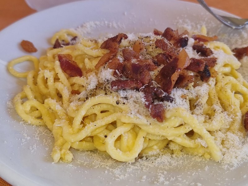Spaghetti carbonara with crisp guanciale and grated pecorino